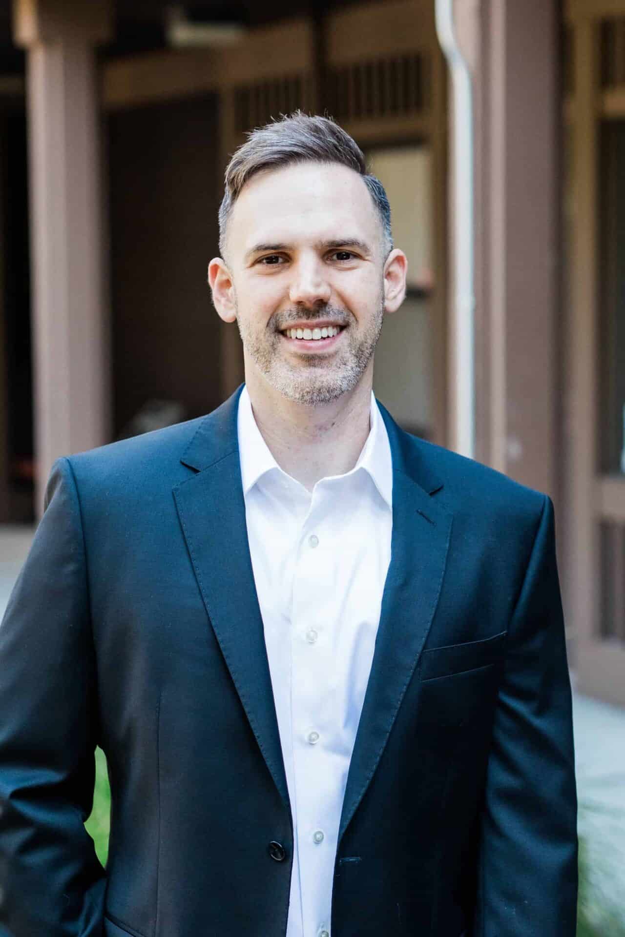 dr. jordan richert smiling in dark suit scaled